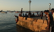 Zanzibar youth jumps into the Indian Ocean from the Forodhani Gardens park in the historic...
