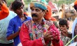 Rajasthani folk artist and Foreign tourist dances during a procession on the evening of Wo...