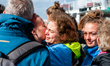 A climate activist is seen saying goodbye to her family, before the boat from where they a...