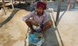 A worker is having his lunch with Ruti and Daal during a break in a Stone Crashing Plant i...