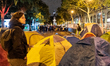 Green activists stand on the camp where dozens of tents were installed, located between th...