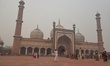 A man cleans the courtyard of Jama Masjid (Grand Mosque ) amid heavy smog in Delhi,  India...
