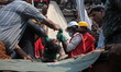 (FILES) In this photograph taken on April 25, 2013,Civilians rescue an injured garment wo...