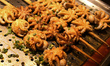 BBQ grilled baby octopus seen for sale on Zhongshan Snack Street, the biggest night food m...
