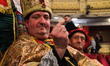 An spectator wearing a fancy dress attends to the draw of Spain's Christmas lottery named...