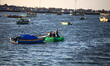 Young Palestinians on their boat made from remnants of empty plastic bottles inside the po...