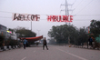 A banner with 'Welcome Ambulance' is seen at the road which blocked since 15 December 2019...