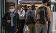 A Man Wearing a mask is seen exiting an MTR train in Kowloon Tong District on January 22,...