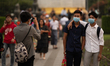 People with protective masks take a photo in downtown area of Yangon, Myanmar on January 2...