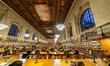 Inside the Rose Main Reading Room, the main reading room with side books and large windows...