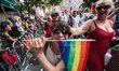 Parade participants on Christopher Street enjoying the 2013 New York City Pride Parade, wh...