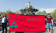 "Refugees Welcome zeigt Solidarität" (Refugees Welcome showing solidarity) is during the R...