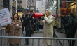 Protesters stand outside the J.P. Morgan building in Midtown Manhattan on February 25th, 2...