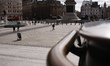 A man walks across an almost deserted Trafalgar Square in London, England, on March 17, 20...