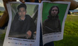 Police show pictures of two Poso People Search Lists (Poso) of East Indonesian Mujahidin (...