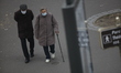 Old people with a protective mask seen walking, on March on 21, 2020 in Paris as a strict...