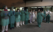 Health workers are seen during the tribute to health services and Police held every day at...