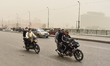 A man wearing face mask rides a motorcycle during a sandstorm in Cairo, Egypt, 05 April 20...