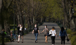 people enjoy a walk at the entrance to Krakow's Planty Park in full spring bloom.
On Thur...