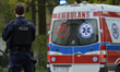 A street scene showing a medical emergency and Police intervention after a man collapsed o...