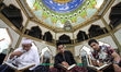 People are seen reading the Koran at night during the holy month of Ramadan at the Mosque...
