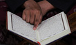 People are seen reading the Koran at night during the holy month of Ramadan at the Mosque...