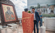 Priest Ventsislav Tachev blessing the mayor of the town of Byala, Penyo Nenov and the depu...