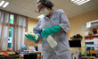 The school's staff must clean and disinfect every classroom, every chair, every bench befo...