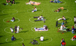 People practice social distancing in Domino Park in Williamsburg during the coronavirus pa...