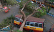 A Passenger bus damaged by a fallen tree due to Cyclone Amphan, is seen in Kolkata, West B...