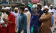 Muslims gather in front of the Baitul Mukarram National Mosque to offer Eid-Al-Fitr prayer...