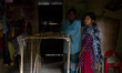Father and his daughter is preparing a shelf inside their house for domestic use in Shunam...