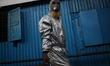 A man wears PPE as he going back home from Dhaka after the government-imposed lockdown at...