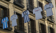 Erseys of football teams of La Liga are hanged at the commercial Preciados street during p...