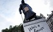 The Parliament Square statue of Britain's wartime leader Winston Churchill stands defaced...