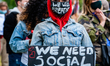 A Black woman is holding an anti racist placard, during the second massive Black Lives Mat...