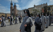 Members of different catholic religious orders seen during a Corpus Christi procession led...