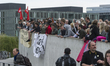 Against demonstrators , Germany on the opposite side of the Spree unfurled banners at the...