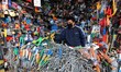 A hardware seller cleaning items inside his shop in Srinagar, Kashmir on June 13, 2020. Ma...
