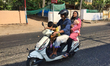 Couple travel on a scooter with their children in the city of Thiruvananthapuram (Trivandr...