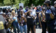 Hundreds take part in a Black Men Rising march and rally to protest police brutality, equa...