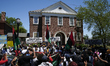 Community members stage a rally outside the Camden History Society during a Black Lives Ma...