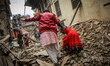 Mother and daughter are struggling to go through the roads of rubbles. Sankhu, Nepal. May...