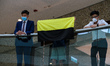 A possible new flag for the pro-democracy movement is held during a lunchtime protest in I...