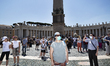A belivers with a maskface during the Pope Francis sunday Angelus at San Pietro square in...