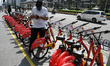 Residents try the Bike Sharing Service in a place that has been provided in the Bundaran H...