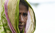 Woman in a flood affected village in Morigaon district of Assam, in India on Monday, 20 Ju...