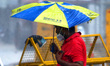 Indian People during a Heavy Monsoon Rain shower in Ajmer, Rajasthan, India on 24 July 202...