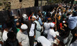 People wait for the first official Friday prayers to start outside Hagia Sophia Mosque on...