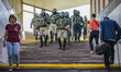 Militarized police patrols the entrance of the Minsk metro, Belarus, on August 11, 2020 pr...